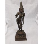 An Indian bronze of Krishna raise on stand, H.60cm