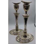 A pair of early 20th century silver candlesticks, hallmarked Sheffield, 1932-33, maker William