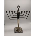 A silver menorah, Star of David finial, hallmarked Birmingham, 1946, engraved, 323g H.27cm