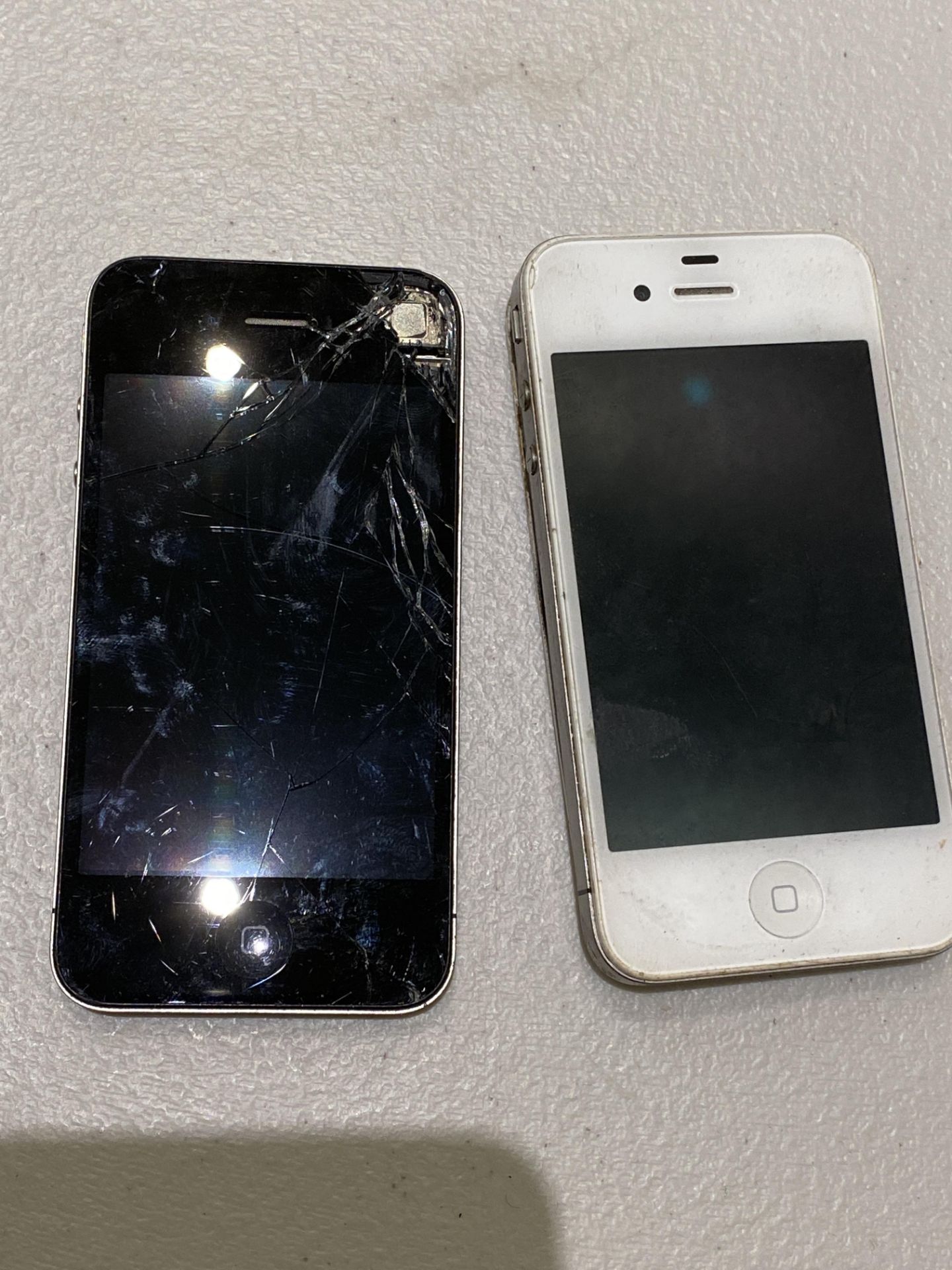 2 Apple Iphones - Both Damaged Cracked Screens and Cracked Rear Covers
