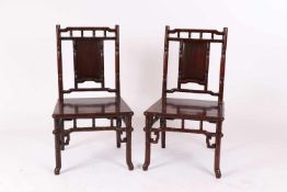 Paar Stühle, China Anfang 19. Jh.Rosenholz, aufwendig geschnitztes Gestell. Bambusdekor,