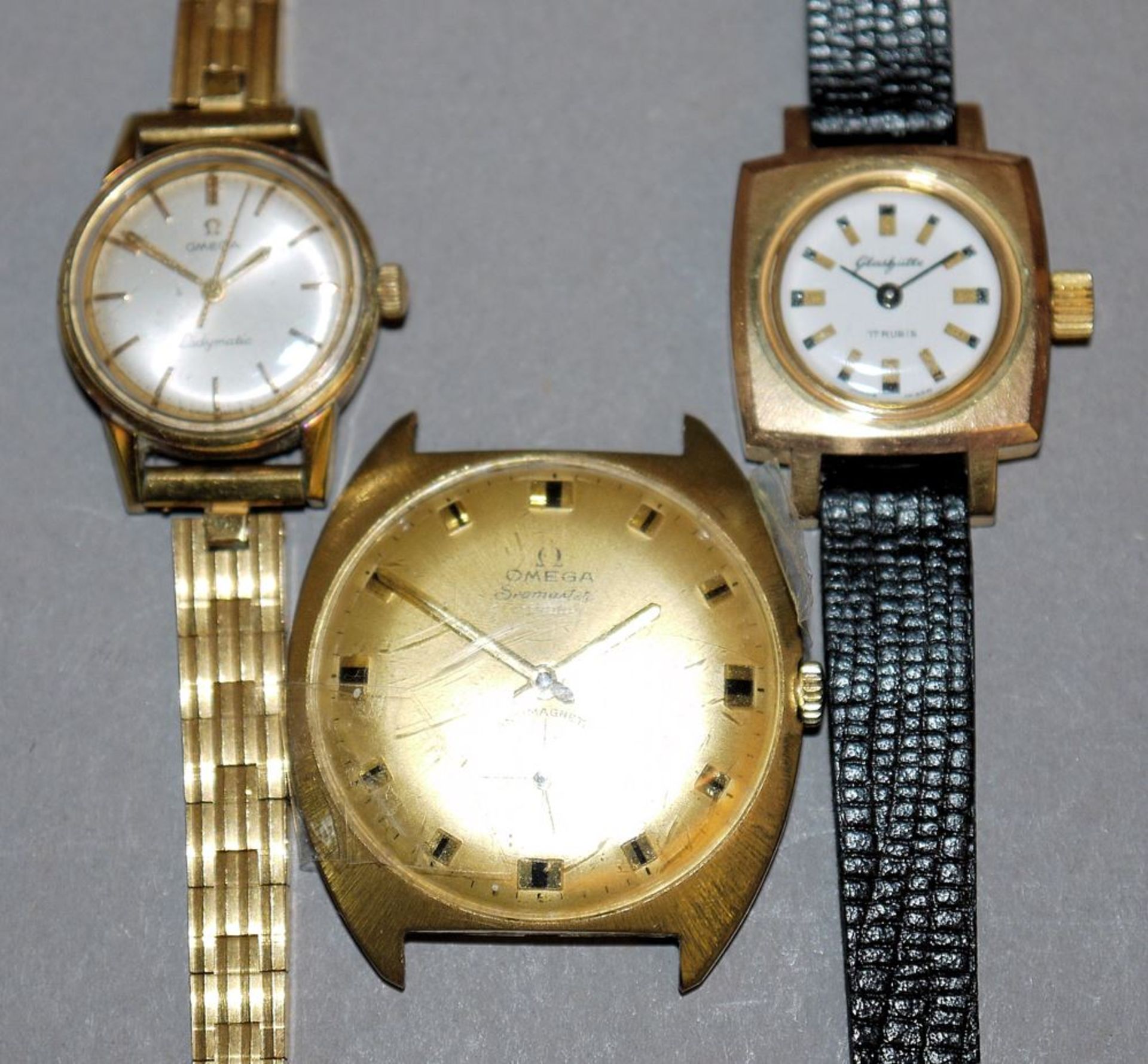 Zwei Damen- und eine Herrenarmbanduhr, Glashütte und Omega, 1960er/70er Jahre