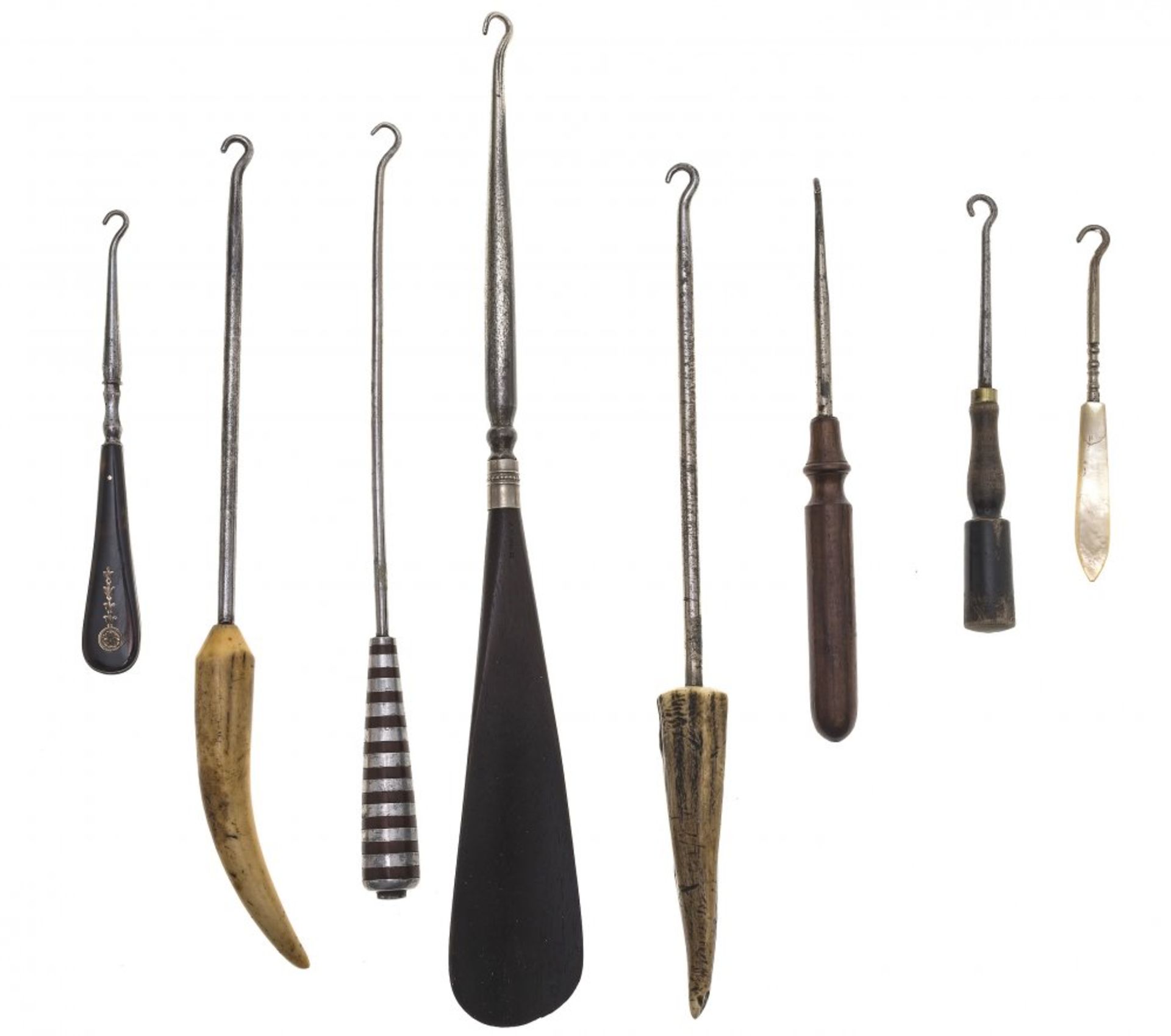 Eight boot and glove pullers (button hooks)