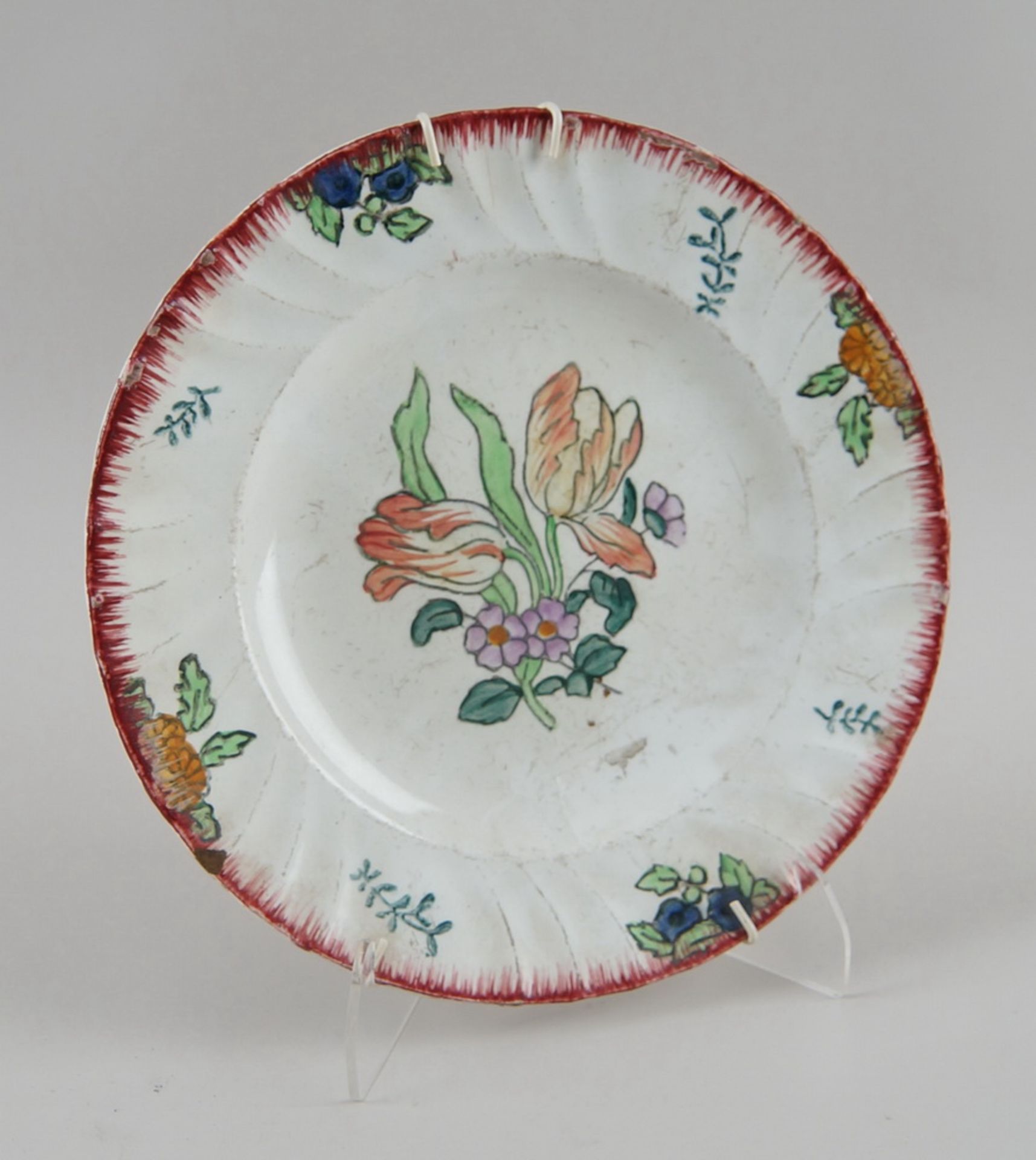 Keramikteller, floral bemalt, Altersspuren, verso gemarktet, Durchmesser 24,5cm