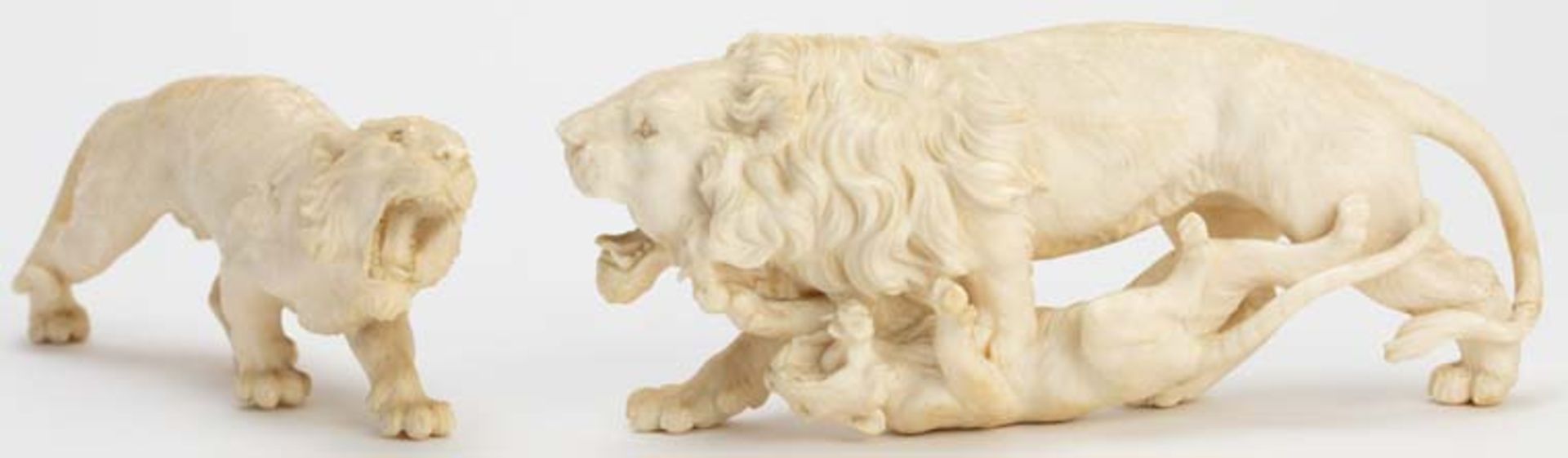 Pair of finely carved ivory lions