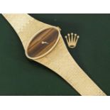 Rolex-Damenarmbanduhr aus den 60er JahrenGelbgold, gest. 750. Querovales Uhrengehäuse, Zifferblatt