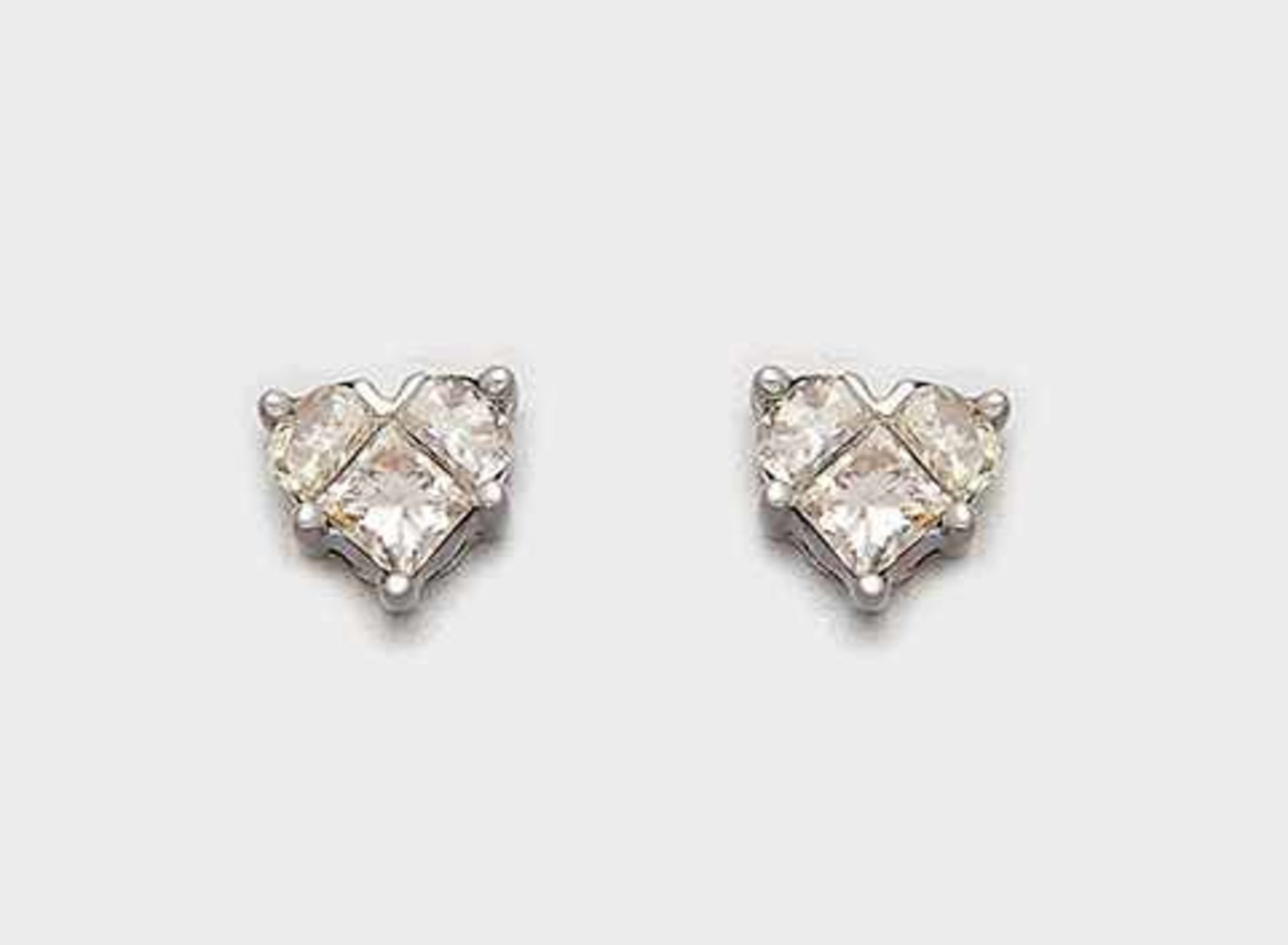 Paar feine Diamant-HerzohrringeWeißgold. 18 ct. Schauseitig ausgefasst mit insges. 6 Diamanten im