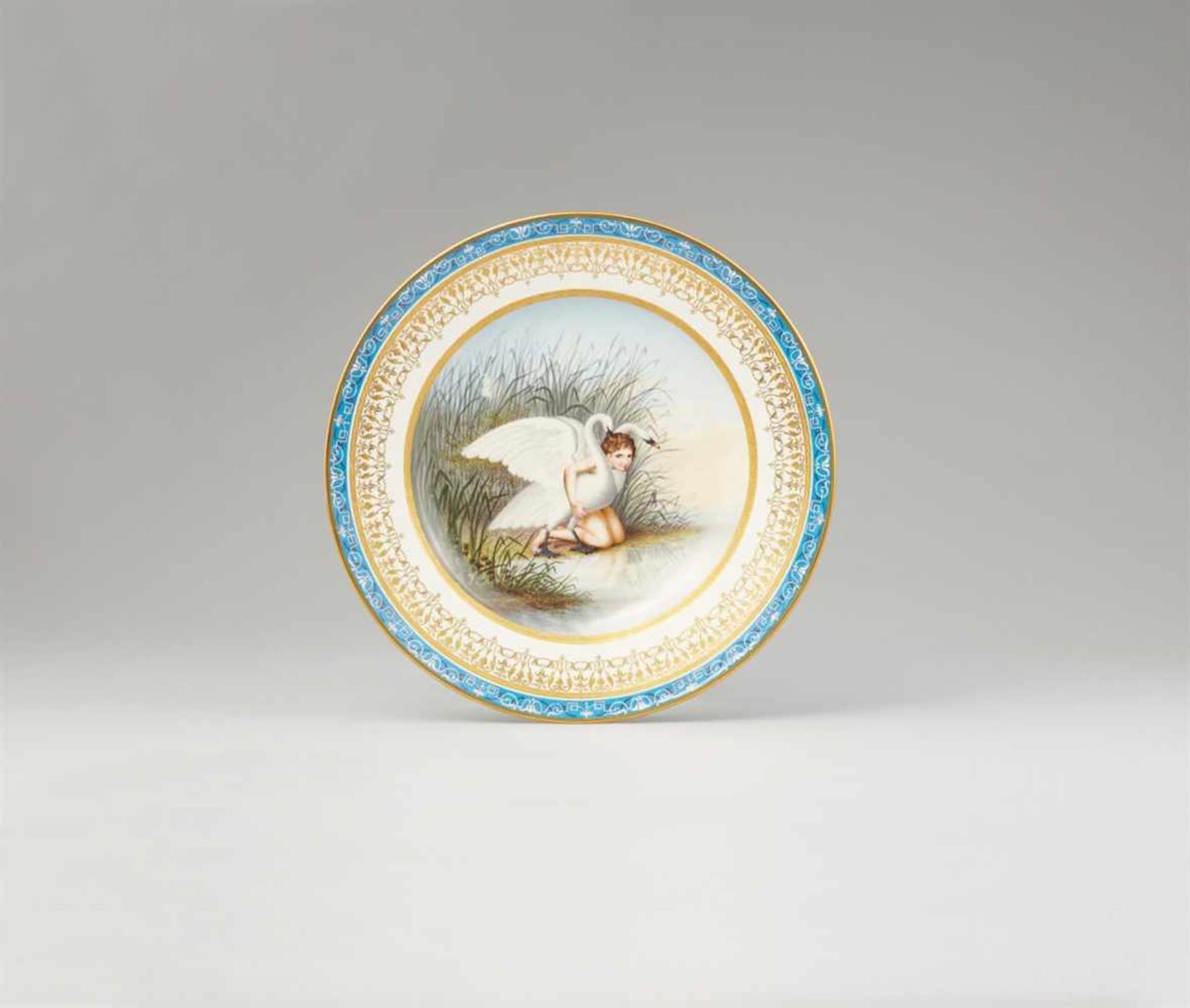 A Vienna porcelain plate with Cupid and two swansShallow dish decorated with a depiction of Cupid