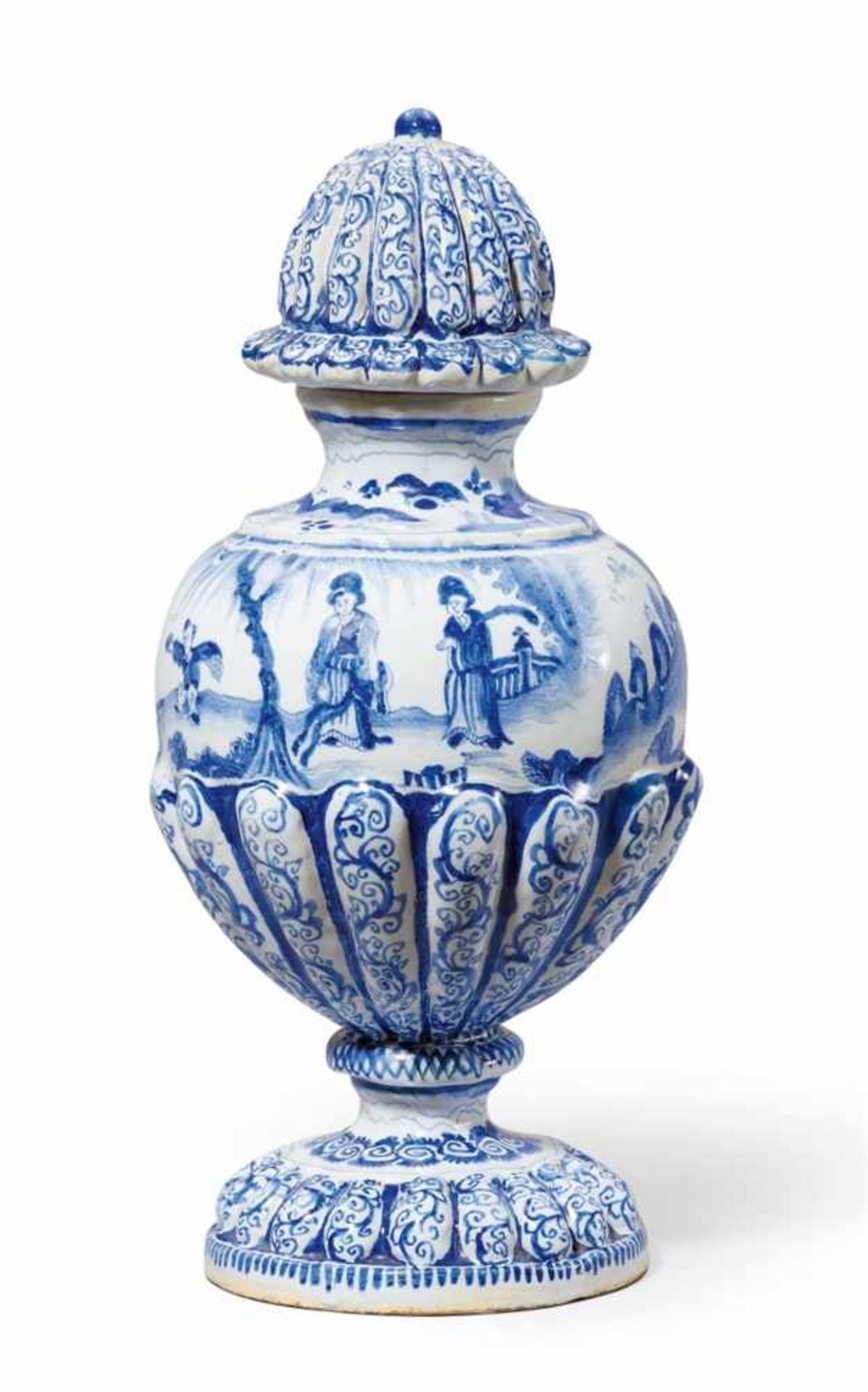 A Berlin faience vase and cover with Chinoiserie decorBaluster-form vase with gadrooned base,