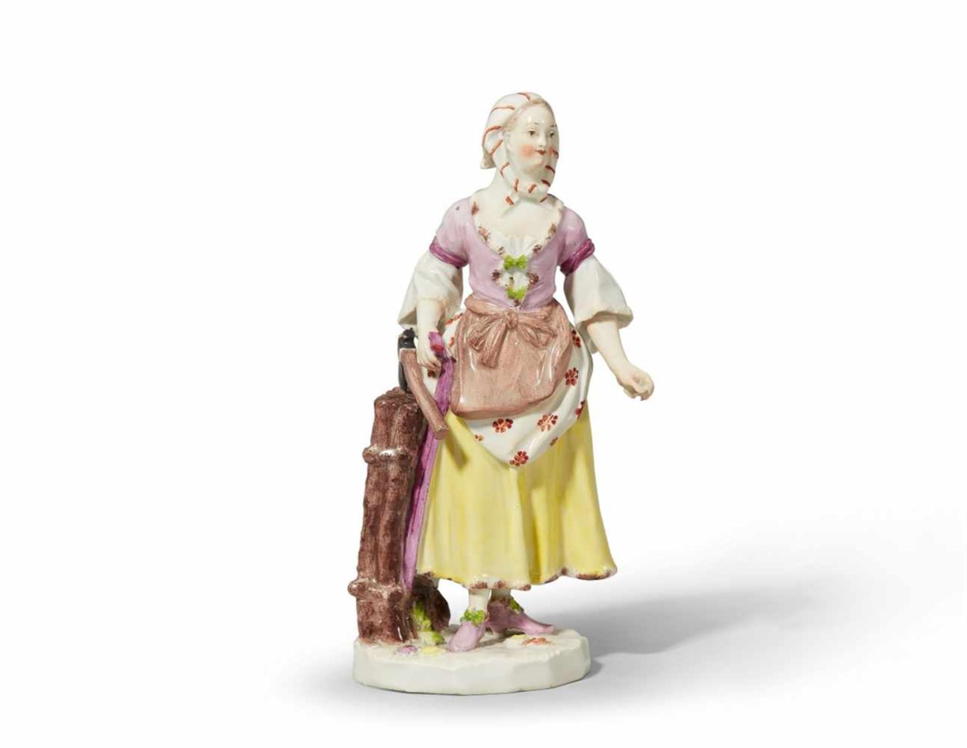 A Vienna porcelain figure of a girl carrying woodFinely painted figure of a girl in an apron