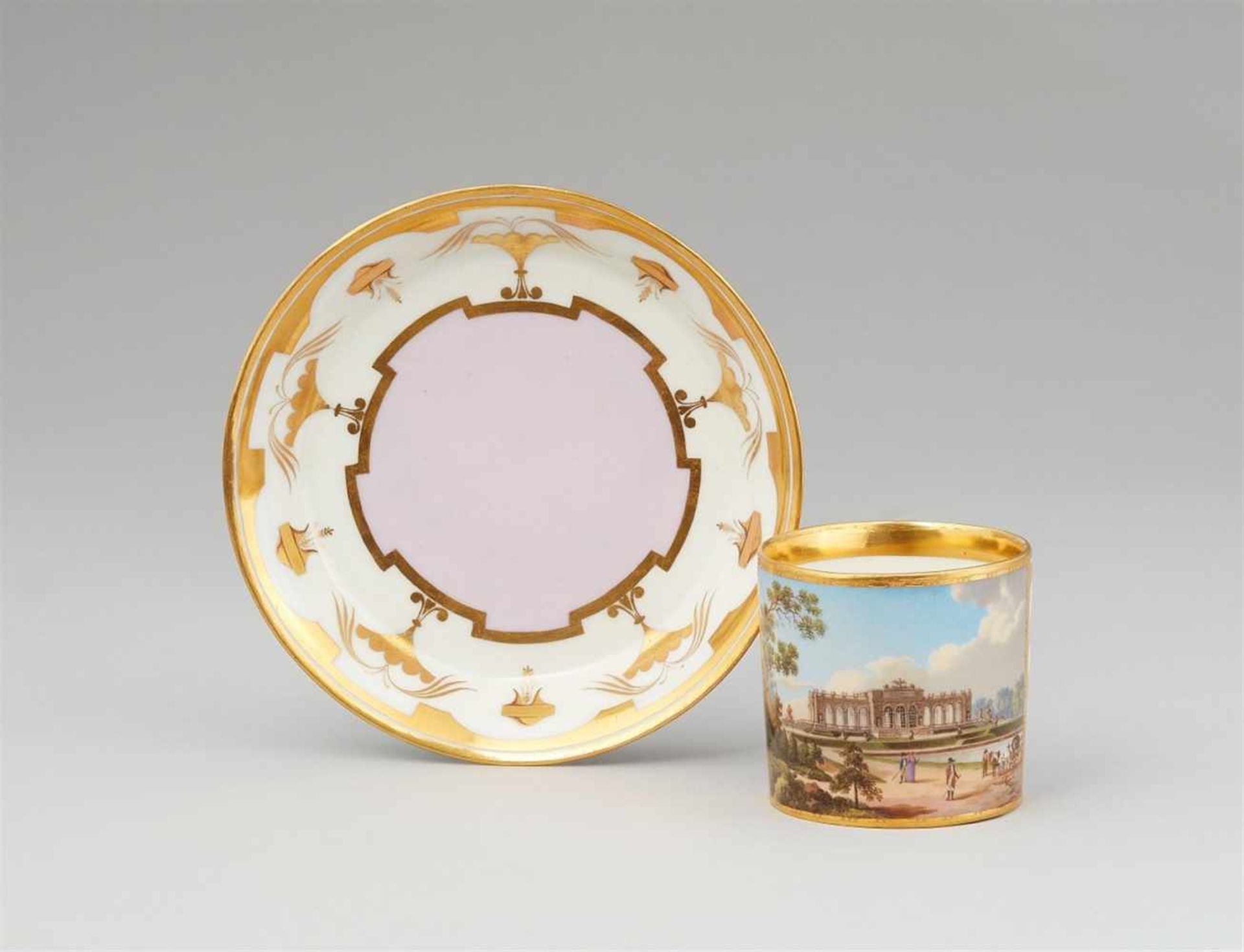 A Vienna porcelain cup and saucer "Vue de la Gloriétte au jardin de Schoenbrunn"Of cylindrical