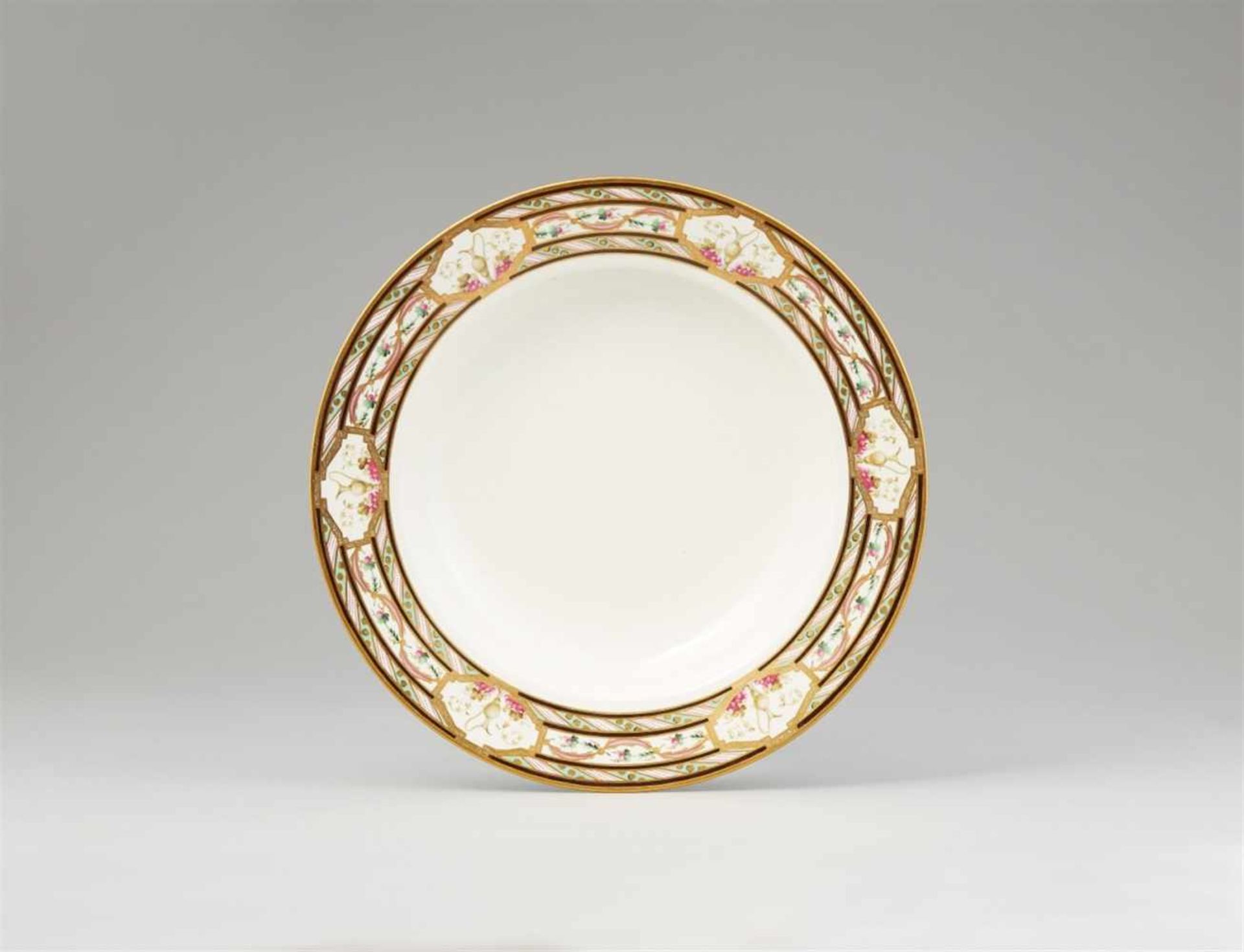 A Vienna porcelain dinner plate with vase decorDeep dish painted with three concentric bands of