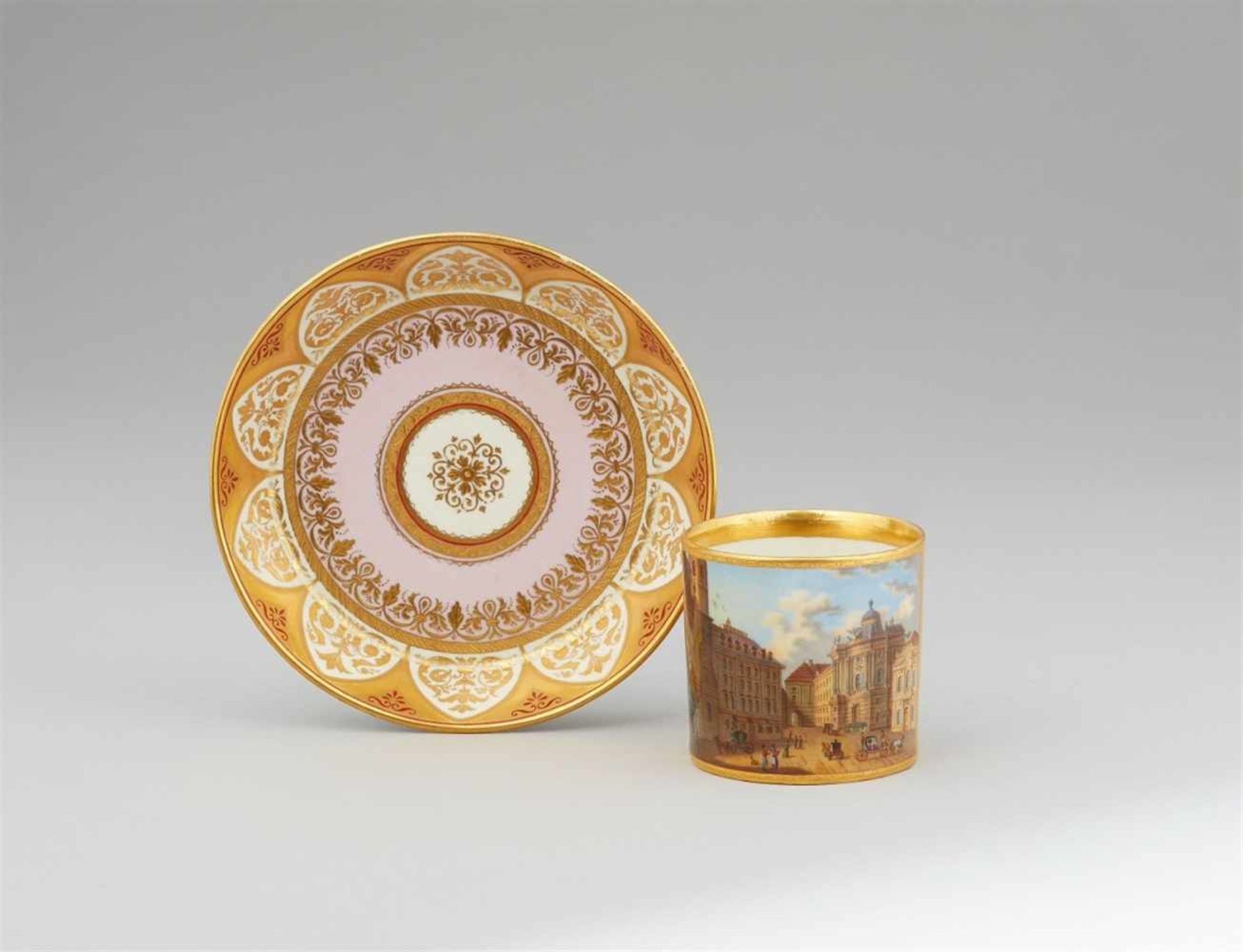 A Vienna porcelain cup with a depiction of MichaelerplatzOf cylindrical form with original saucer.