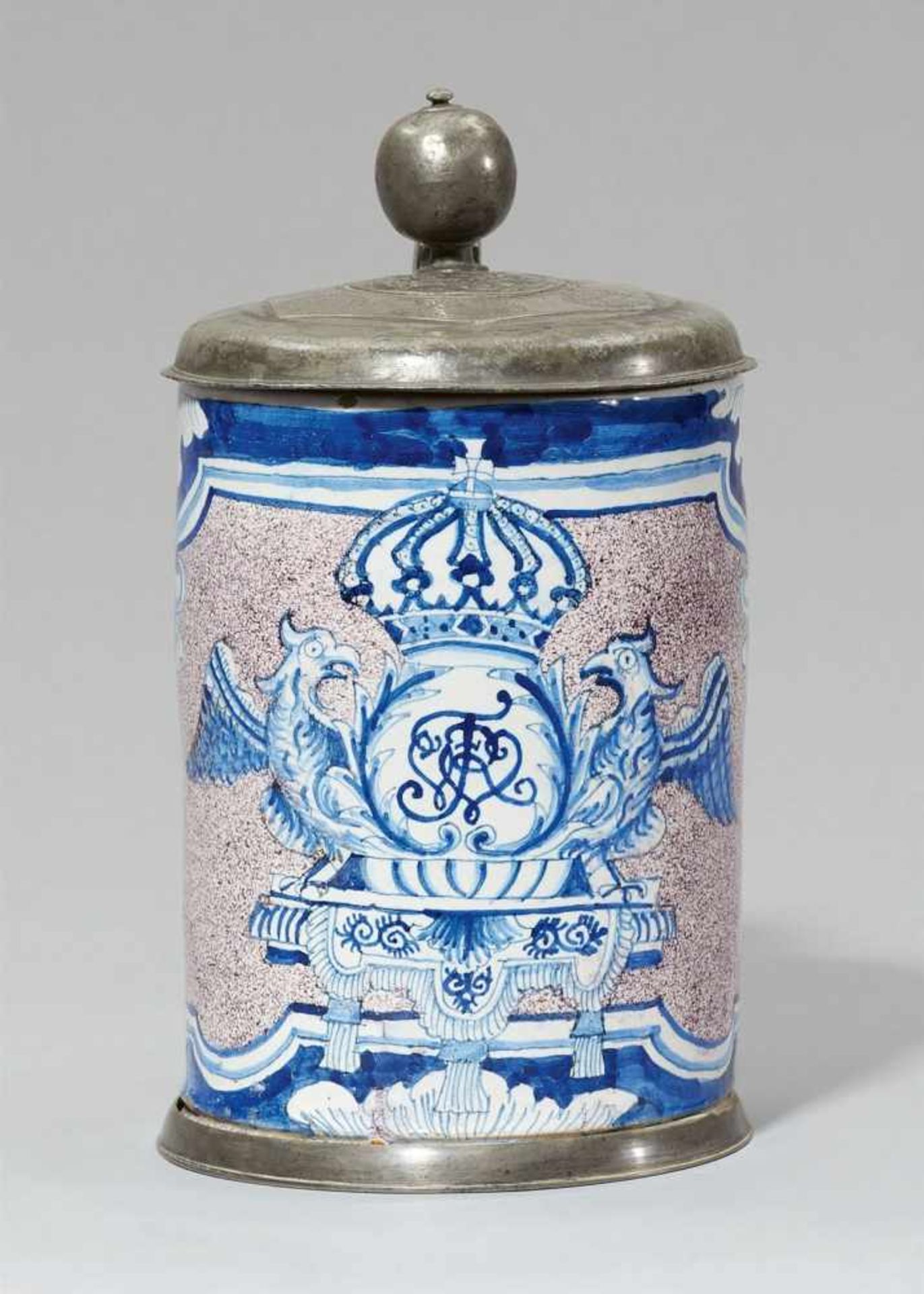 A Berlin faience tankard with the royal monogramDecorated with a large foliate cartouche with the