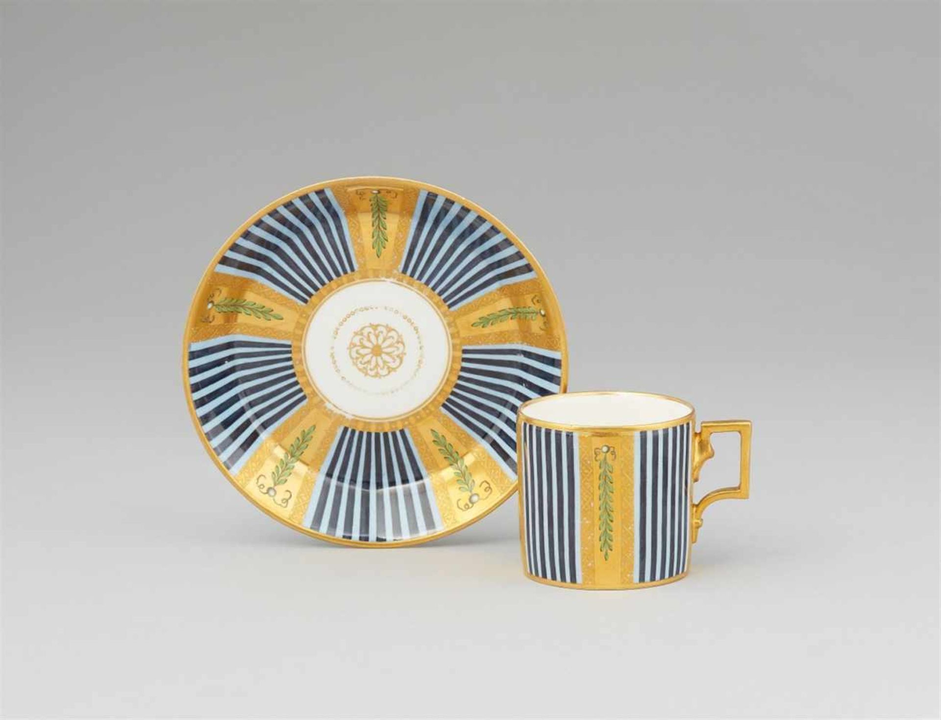 A Vienna porcelain cup and saucer with blue striped decorOf tapering cylindrical form, with original