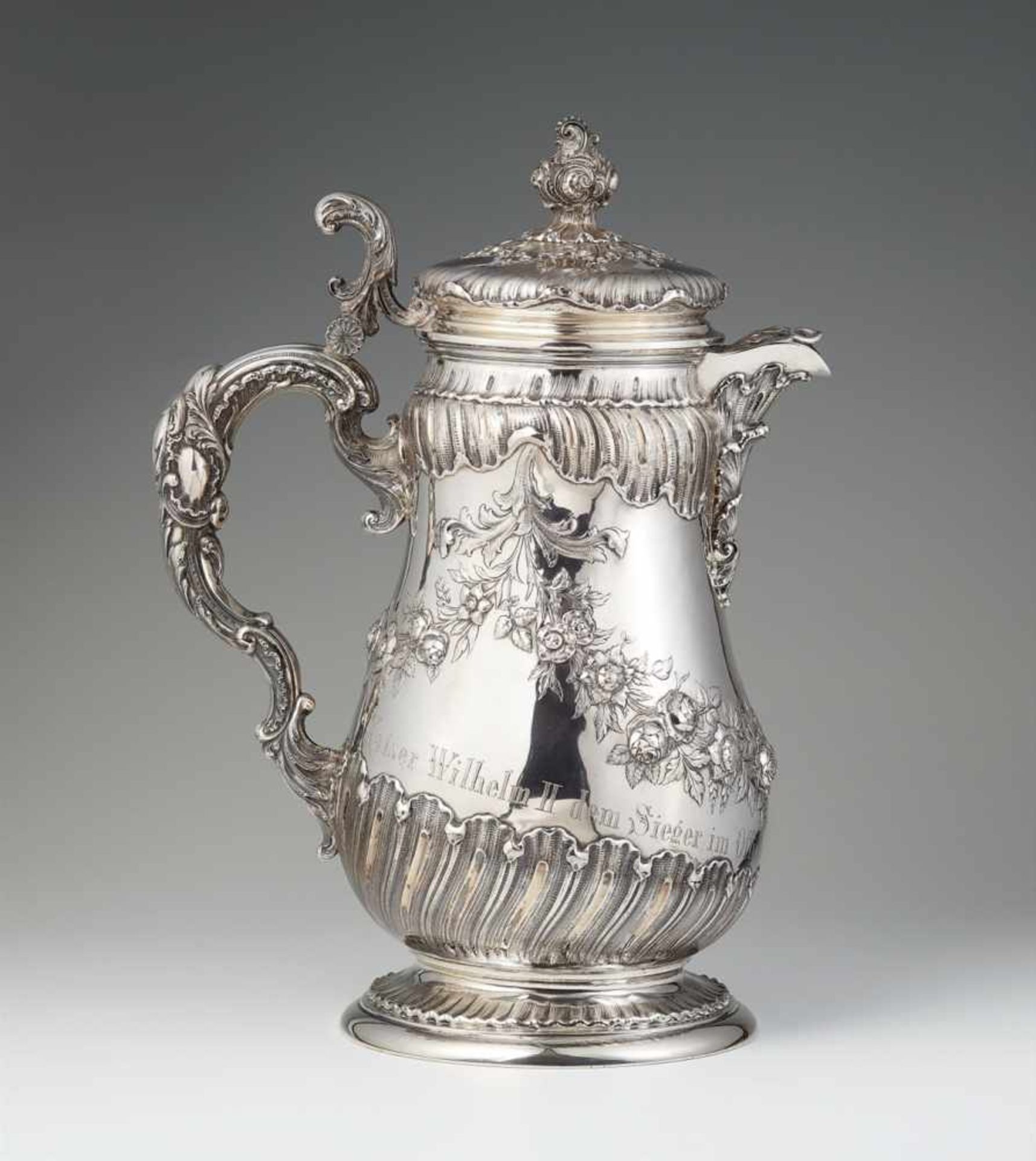 A Berlin silver horse racing trophyA large pear-form pitcher with slip lid, engraved "Kaiser Wilhelm