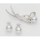 An 18k white gold diamond and pearl demi-parureComprising a brooch and a pair of earrings custom-