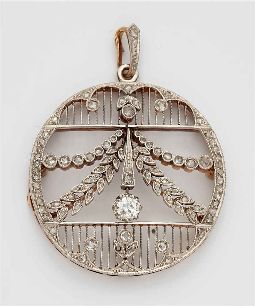 A Belle Epoque 14k gold and diamond pendantPlatinum and 14k gold pendant designed as a delicately