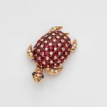 An 18k gold tortoise clip broochFully set with rubies (in total c. 2.20 ct) and 50 brilliant-cut and