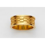 An 18k gold ring with granulationGold ring with moulded edges and a brickwork design in fine