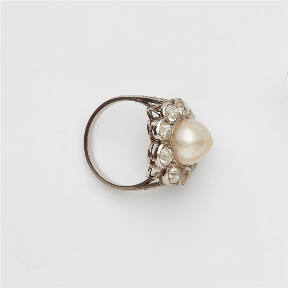 A Belle Epoque diamond and pearl ringA platinum ring with diamond set shoulders and a flower- - Image 2 of 3