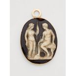 An 18k gold and agate cameo pendantThe oval layered onyx cameo (33 x 27 mm) carved in relief with