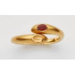 A 21k gold bangle with a Graeco-Bactrian carnelian intaglio and its impressionForged crossover