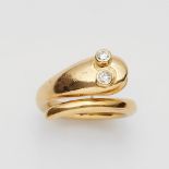 An 18k gold and diamond snake ringPolished forged gold band with a snake's head with open jaws and