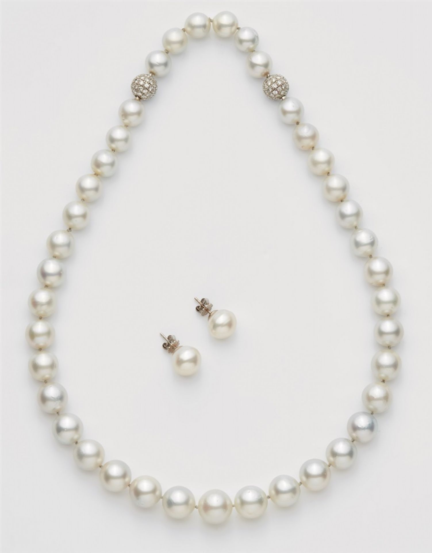 A South Sea pearl necklace and matching pair of earringsA strand of 39 slightly graduated Australian
