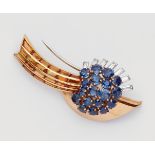 An 18k rose gold sapphire and citrine comet clip brooch18k gold and platinum brooch formed as a