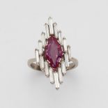 An 18k white gold and diamond marquise ring with a Burmese rubyThe elongated bezel set with a