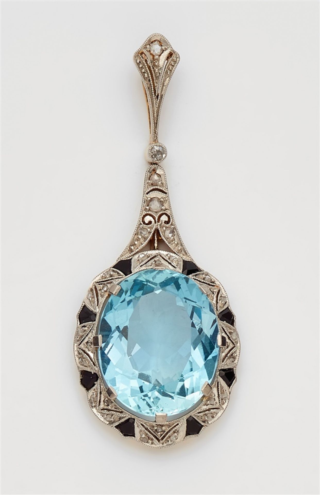 An Art Deco diamond and aquamarine pendantPlatinum and 18k gold pendant set with tiny rose-cut