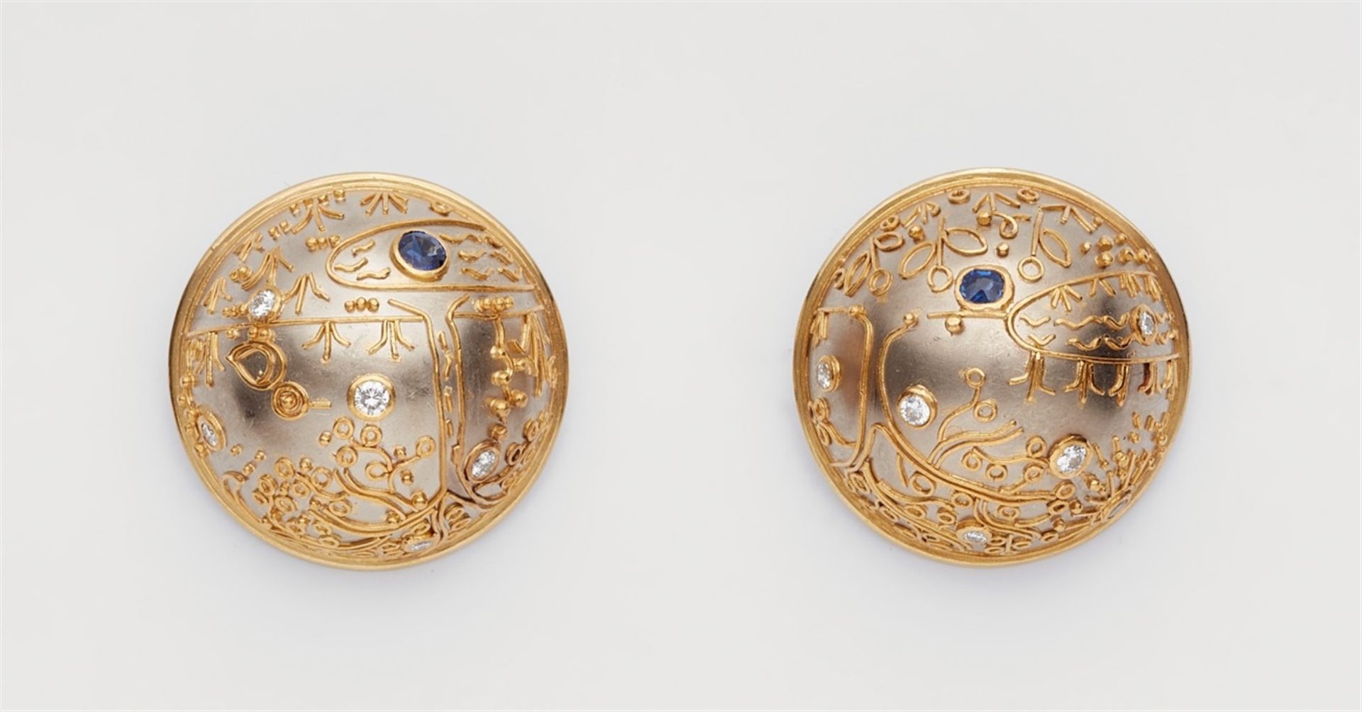 A pair of jewelled clip earrings with granulationPlatinum earrings with hollow semi-spherical motifs