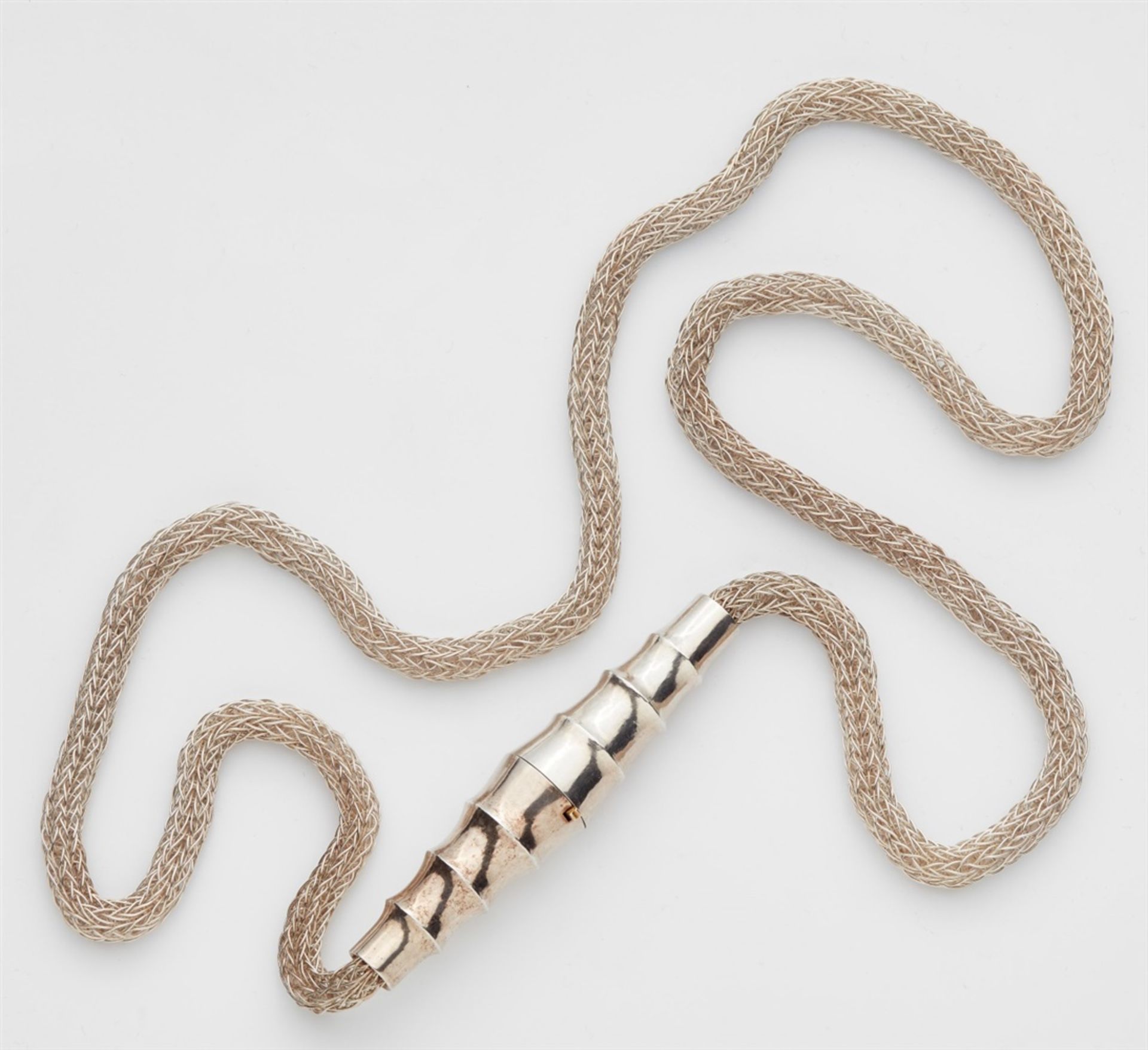 A Sterling silver sautoir with a forged claspNecklace designed as a tubular chain formed from finely