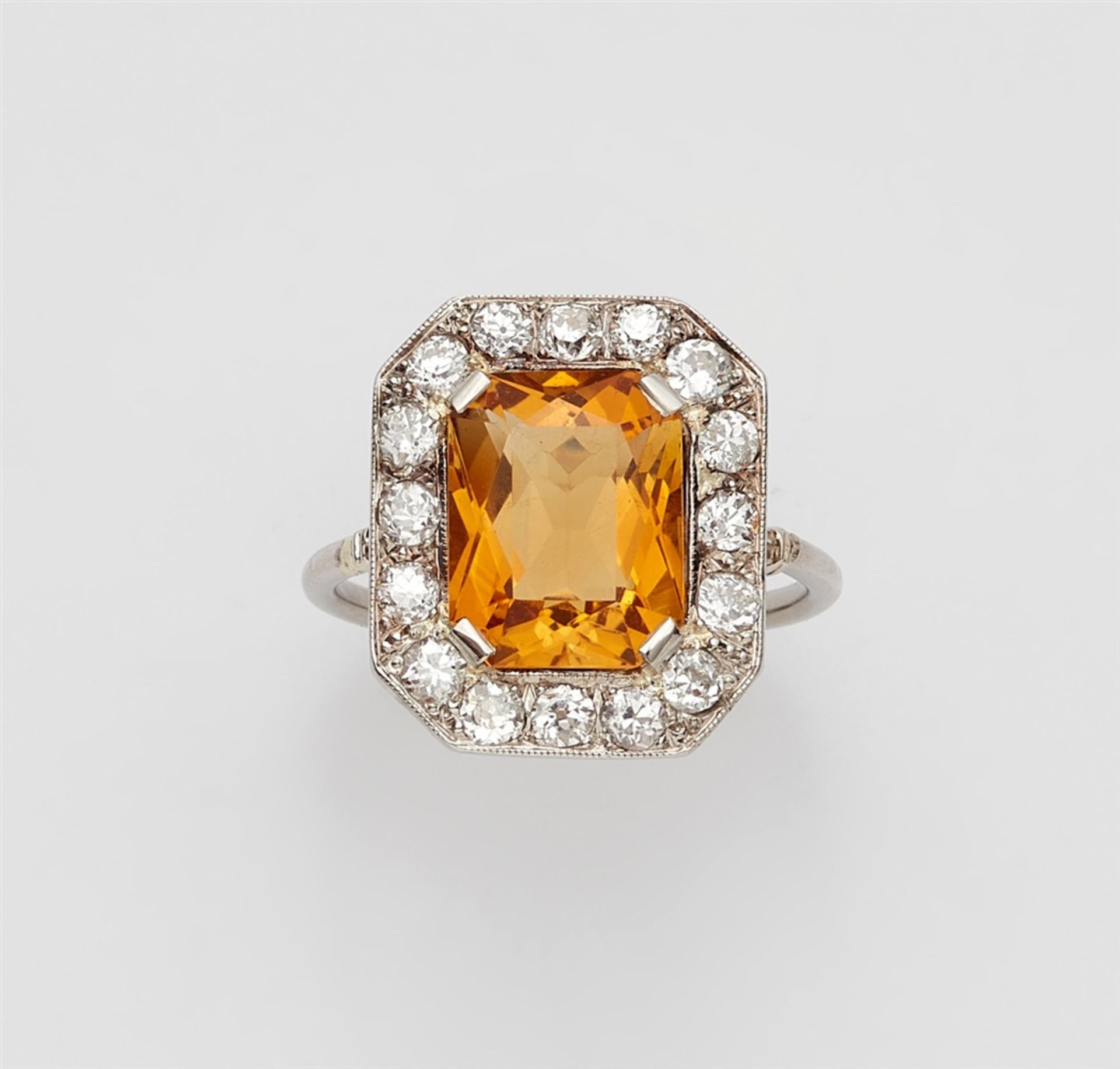 An Art Deco diamond and citrine ring18k white gold and platinum ring, the rectangular bezel