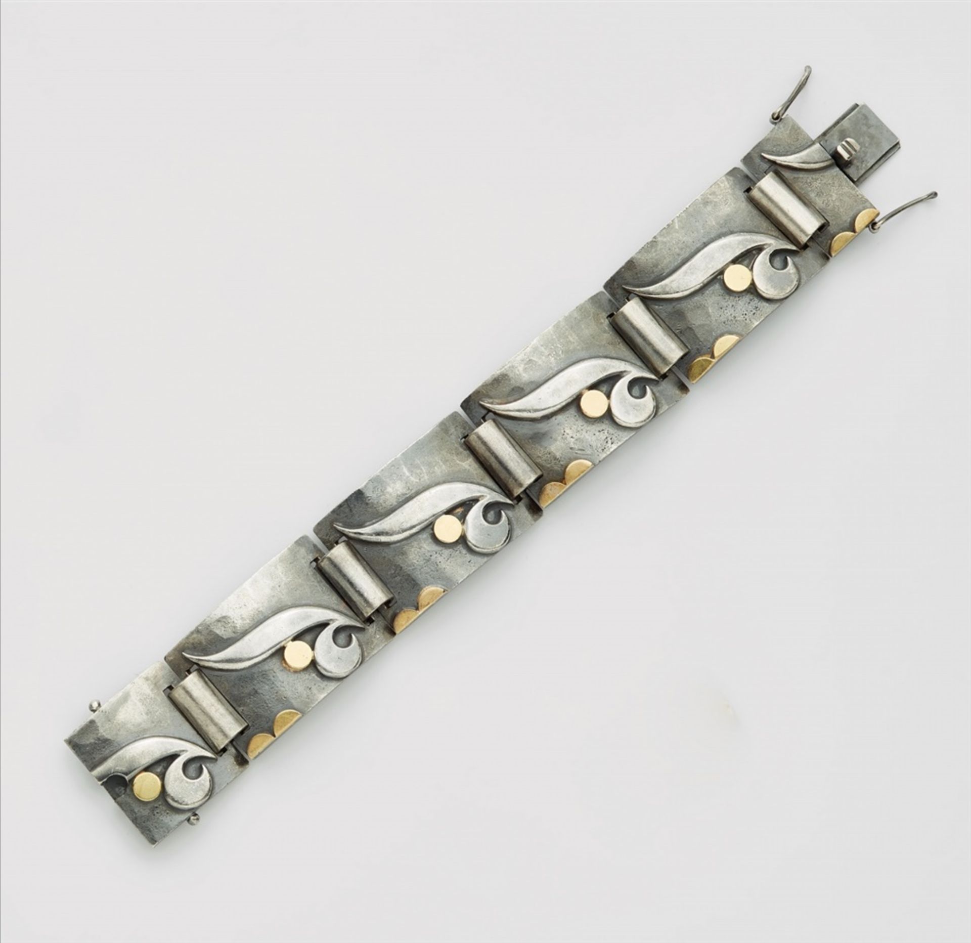 A silver Art Deco braceletSilver, parcel-gilt with 18k gold. Designed as a strand of slightly