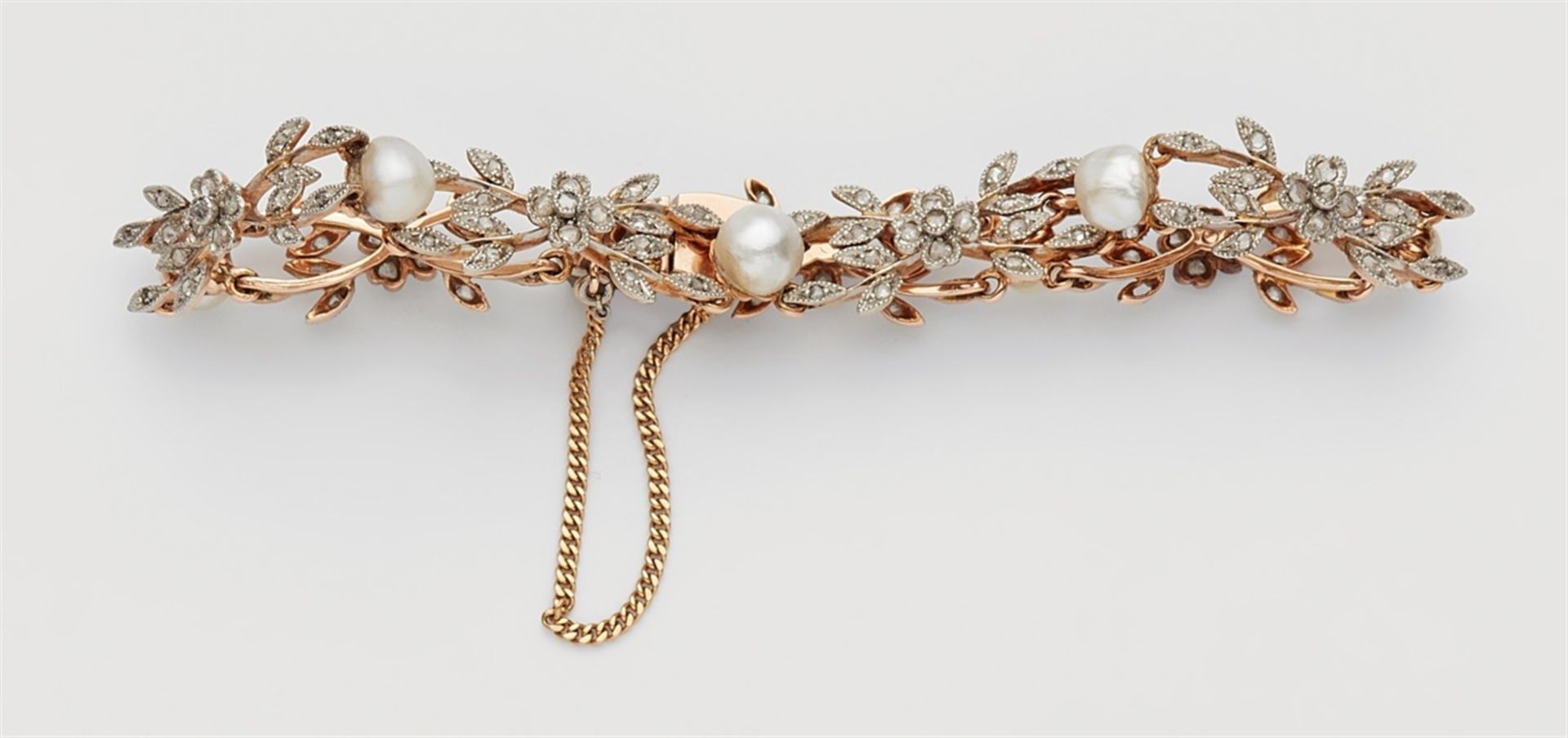 A Belle Epoque Oriental pearl and diamond bracelet14k red gold and platinum bracelet designed as a