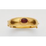 An 18k gold carnelian scarab bangleForged bangle with martelé decor with an ancient Egyptian