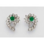 A pair of 14k white gold and emerald clip earringsEscargot-Form earrings set with 28 brilliant-cut