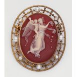 A 14k gold and agate cameo broochSet with an oval layered carnelian plaque finely carved with a