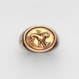 A Sterling silver ring with a gold intaglio castSterling silver ring band with a gold cast of a
