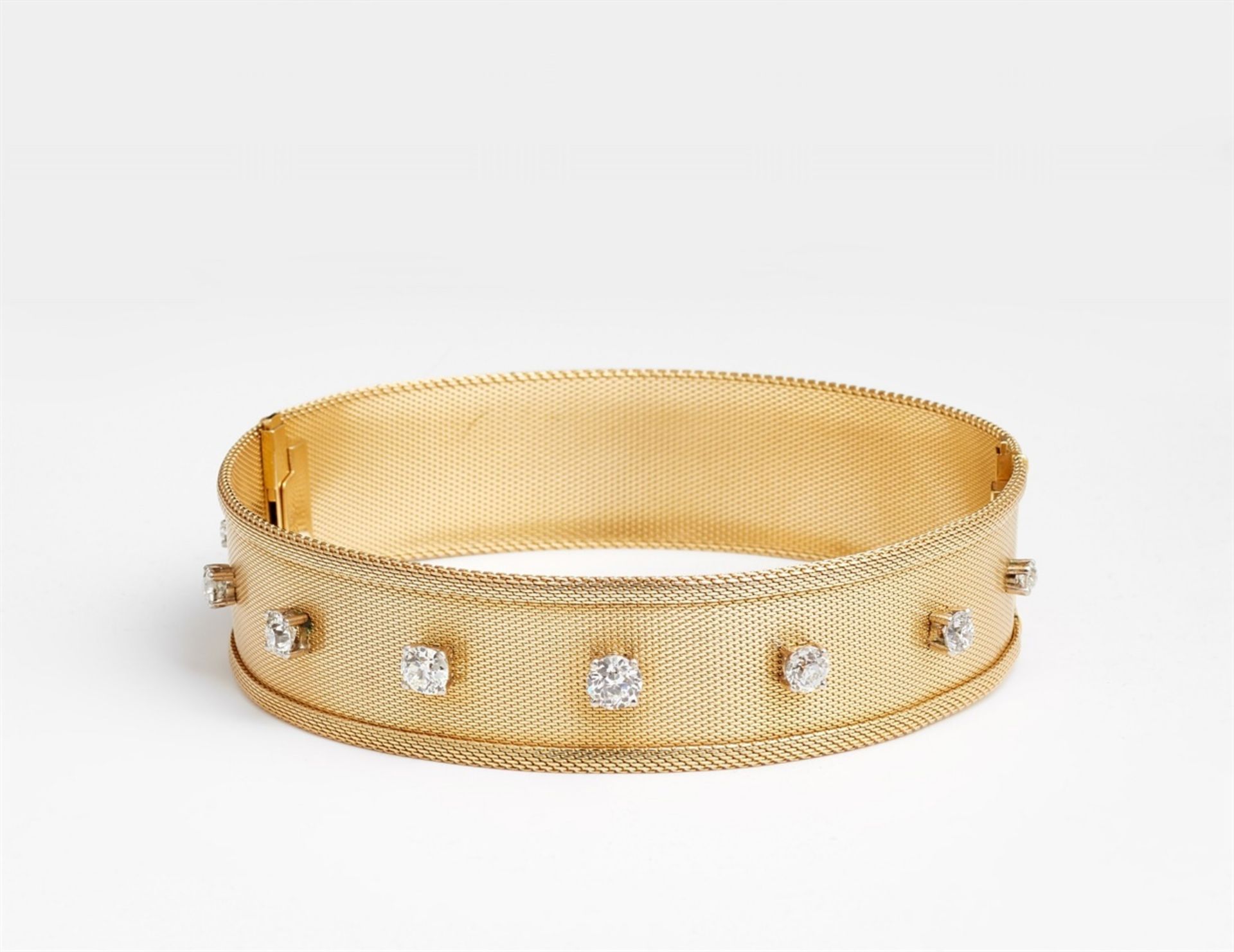 An 18k gold and diamond dog collarA two-piece choker, one half of which can be worn as a bracelet.