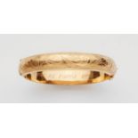 An 18k gold Swedish braceletDomed bangle with a hinge to one side. Engraved Historicist tendril
