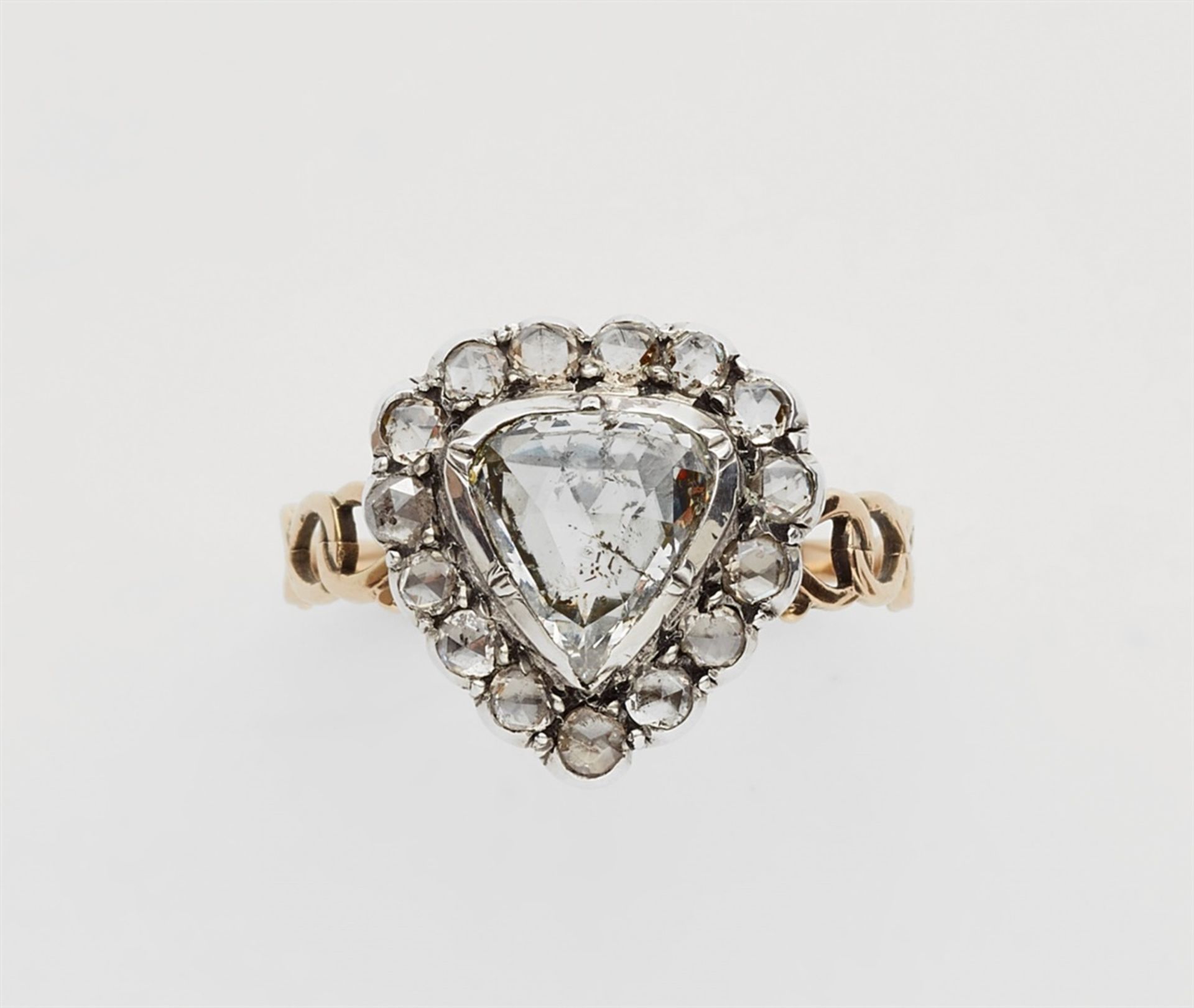 A 14k gold and rose-cut diamond George III heart ringA silver and 14k gold ring with a pierced