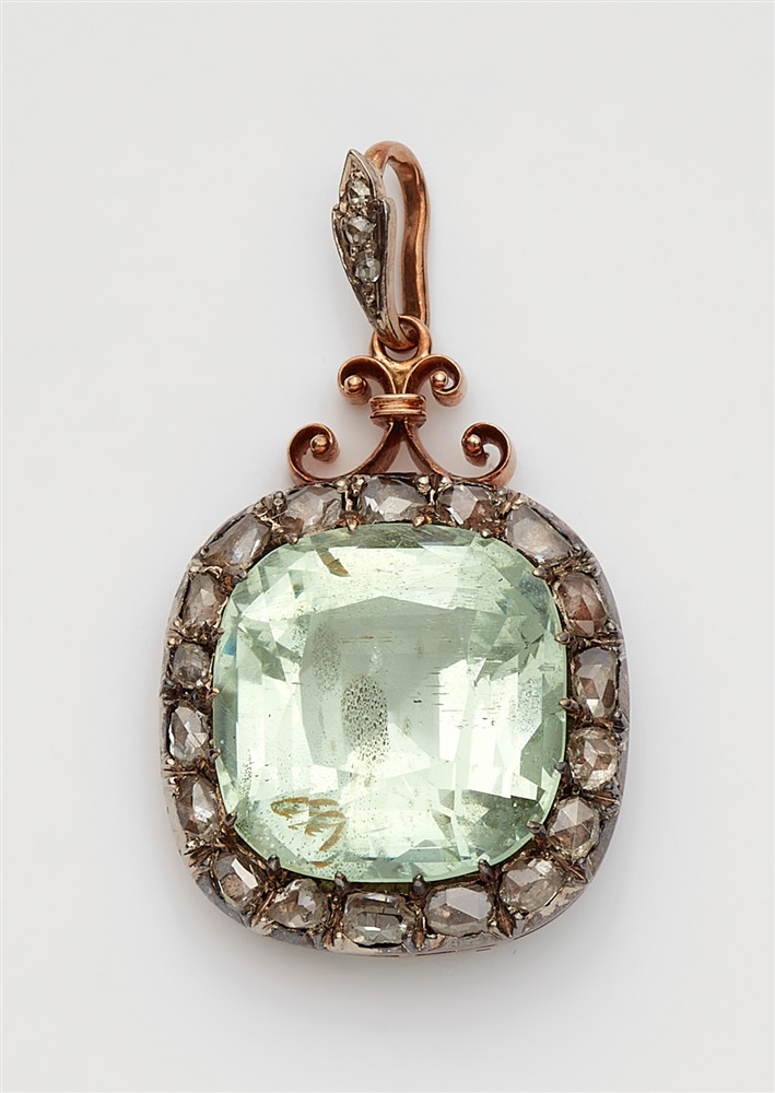 A Belle Epoque beryl pendantA silver and 14k red gold cluster set pendant with a large pale green