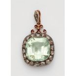 A Belle Epoque beryl pendantA silver and 14k red gold cluster set pendant with a large pale green
