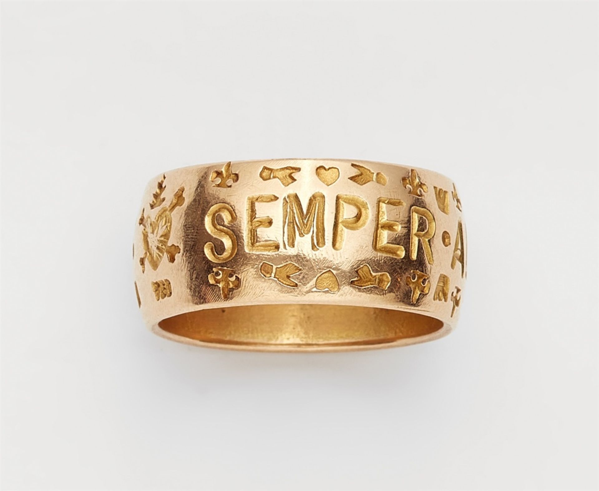 An 18k gold gentleman's friendship ringBroad gold band inscribed "Semper aliquid haeret" and with