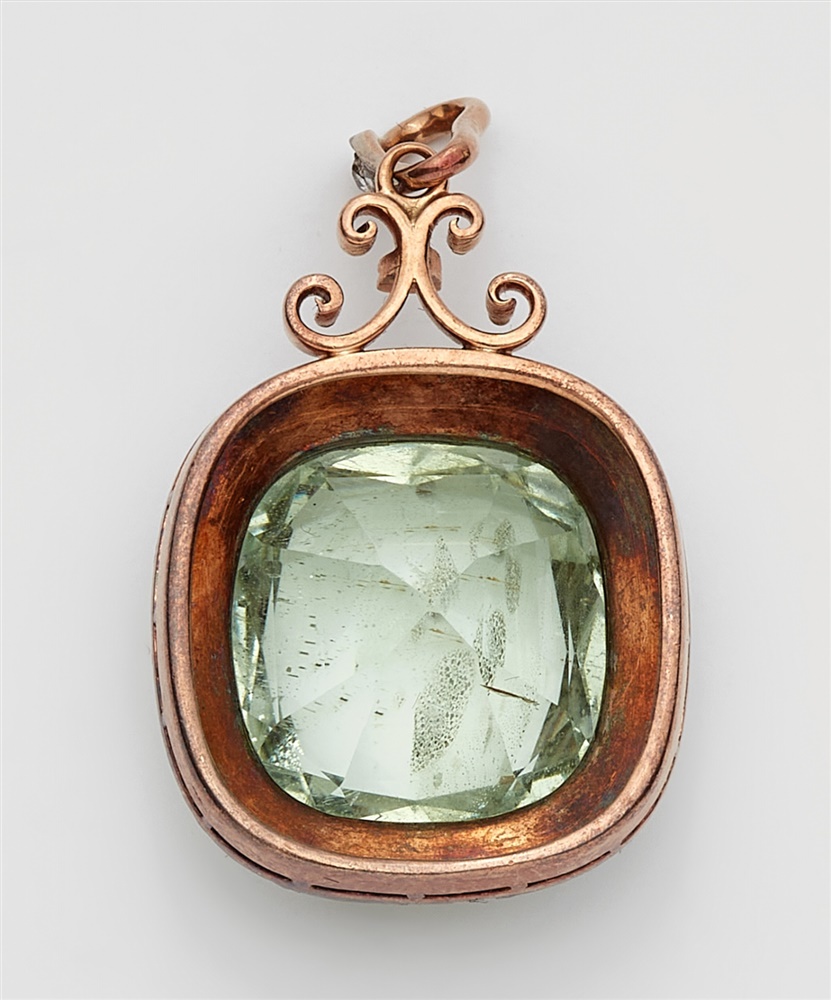 A Belle Epoque beryl pendantA silver and 14k red gold cluster set pendant with a large pale green - Image 2 of 2