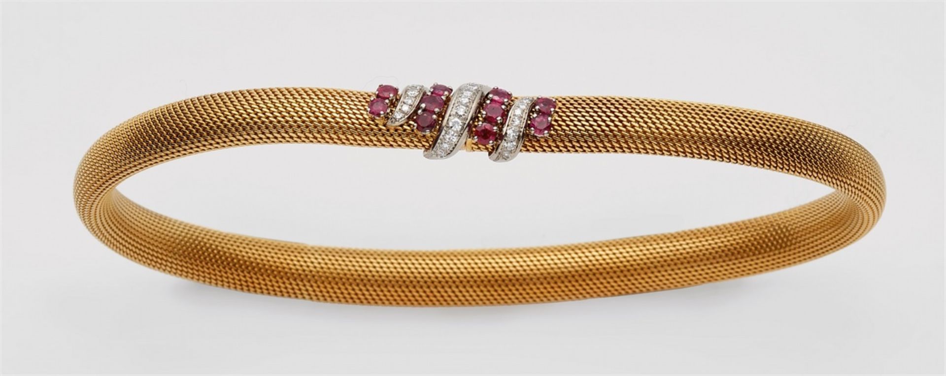 An 18k gold and ruby tubogaz necklace18k bi-coloured gold tubular necklace. The concealed snake-