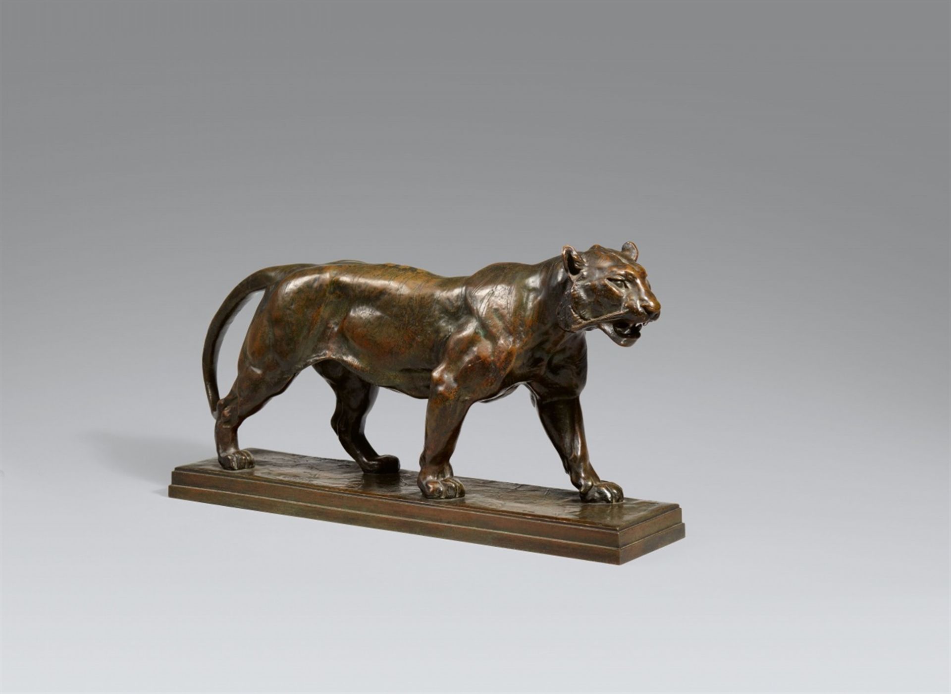 A bronze model of a striding tiger after Antoine-Louis BaryeCast, engraved, chased, and patinated